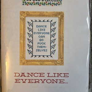 May include: Cross stitch kit with the text "DANCE LIKE EVERYONE CAN GO FUCK THEMSELVES" in a gold frame. The kit includes the brand name "subversive cross stitch" at the top and the words "CROSS STITCH KIT" at the bottom.