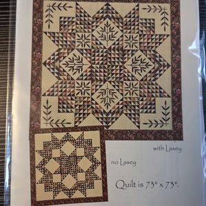May include: A quilt pattern titled Triangle Star by Laundry Basket Quilts, model LBQ-0348. The cover shows two star-shaped quilt designs in cream, brown, and red tones, with text indicating the quilt is 73 inches by 73 inches.