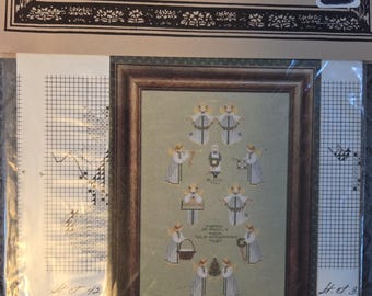 Told In A Garden A Band of Angels Cross Stitch Pattern. Good Condition. Free Shipping.