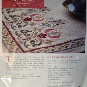 May include: A white ceramic mug with a colorful floral design. The mug features a vibrant array of flowers in shades of pink, purple, and yellow. The handle is a solid white, and the mug appears to be clean and new.