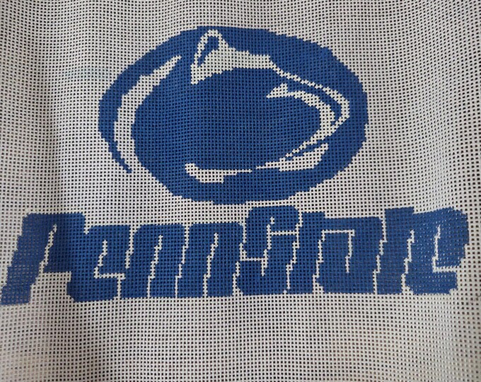 PSU Penn Univ Needlepoint Canvas 13# 10"x7". Preowned Estate Sale Good Condition. Canvas was Rolled. Blue paint upper left near swoosh.