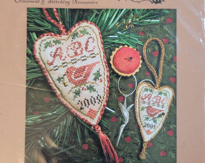 Homespun Elegance Festive Redbird Cross Stitch Pattern. Free Shipping. Used Condition. Includes charm.