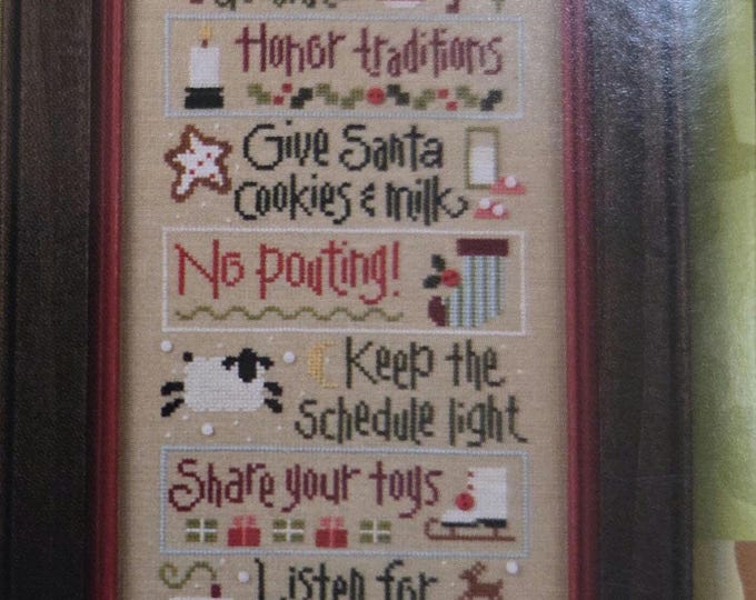 Lizzie Kate Christmas Rules Set of 6 Cross Stitch Patterns. Free Shipping. Good Condition. Buttons Included.