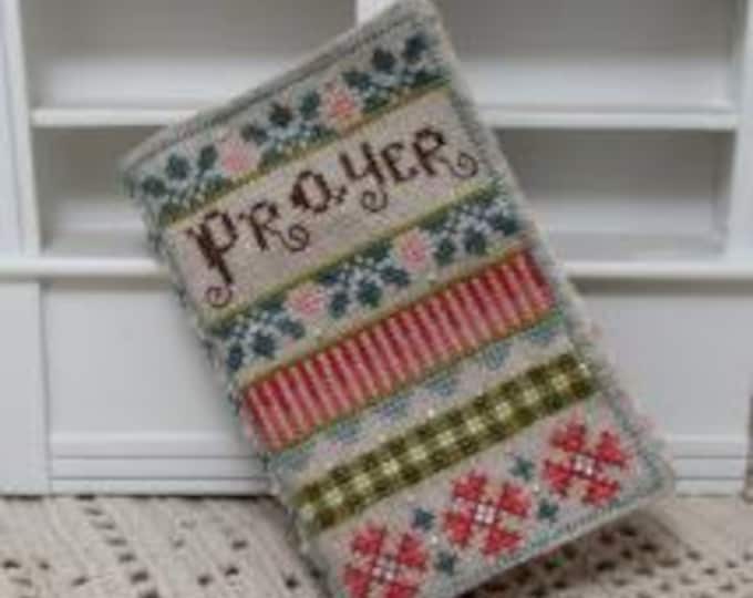 Kira Lyns A Pocketful of Prayer Cross Stitch Pattern, includes a prayer card. Free Shipping. New Condition. Needlework Marketplace Exclusive
