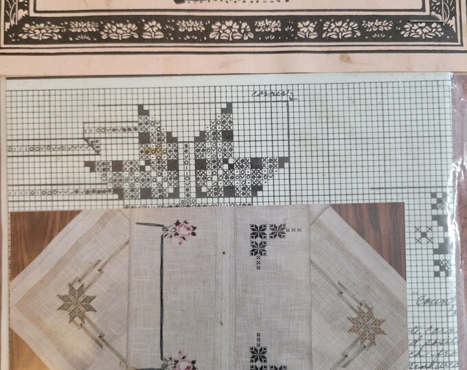 Told In A Garden Roses and Ribbons Cross Stitch Pattern. Packaging is in Older Condition. Free Shipping.