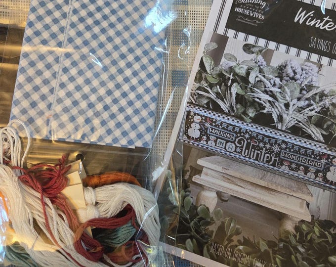 Stitching with the Housewives Sayings of the Seasons Winter Nov 2024 Kit. Includes Chart, Fabric, Floss, Charm, Blue Bag. FREE SHIPPING.