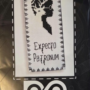 May include: A Harry Potter cross-stitch bookmark kit. The design features the words "Harry Potter" at the top, a silhouette of Harry, and the phrase "Expecto Patronum." The finished size is 2.36" x 7.70" (6 x 19.5 cm).