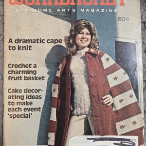 May include: The Workbasket and Home Arts Magazine cover from January 1979. The cover features a woman wearing a red and white patterned cape. The magazine's title is in red, and the cover includes text about knitting, crochet, and cake decorating.