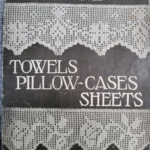 May include: Book cover for a crochet pattern book titled "Old & New Designs in Crocheted Towels, Pillow-Cases, Sheets" by Sophie T LaCroix. The book is number 13 in a series and features two images of crocheted lace.