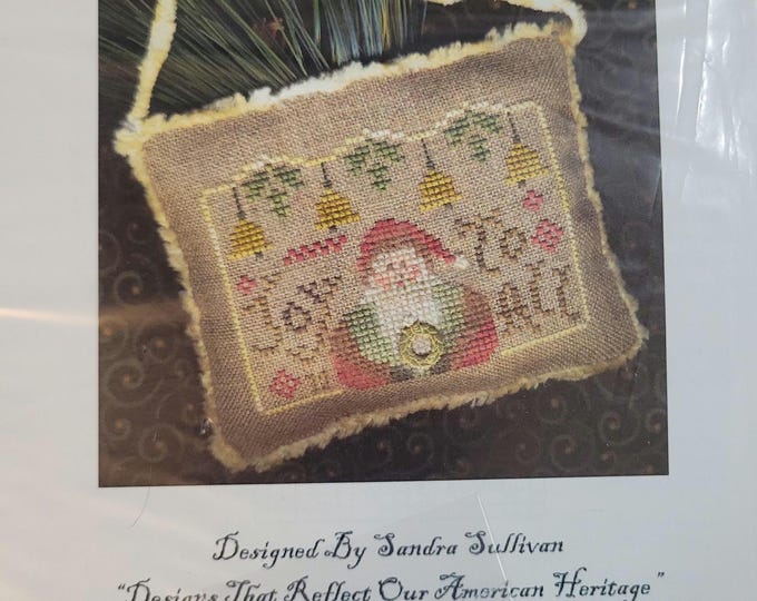 Homespun Elegance 2012 Santa Ornament Joy to All Cross Stitch Pattern. Free Shipping. Used Condition. Includes charm.