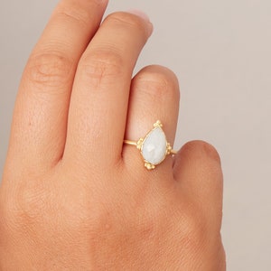 Handcrafted White Moonstone Ring with Matte 18K Gold and Sterling Silver, Featuring a Stunning Pear Shaped White Gemstone