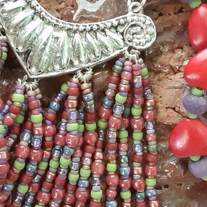 Candy bright fringe necklace with red stone hearts, purple wooden rondelles, pewter focal, Toho, Miyuki, and Czech seed beads
