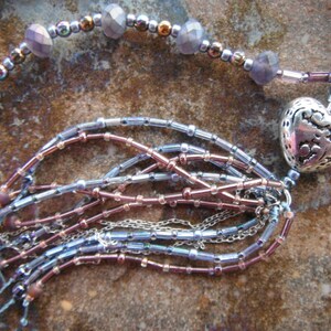 Heart Tassel Necklace with Czech glass in crystal and etched glittery blue bronze, faceted lavender glass, pewter heart, seed beads