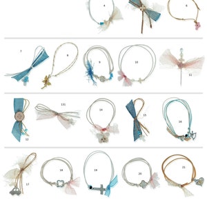 May include: Twenty-one different styles of christening bracelets with various charms, including crosses, butterflies, hearts, and anchors. The bracelets are made with white and blue string and feature delicate lace accents.