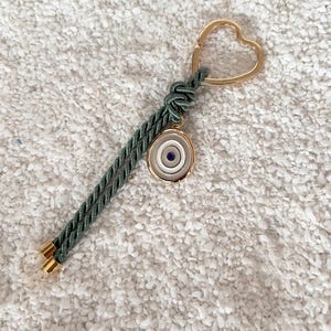Portachiavi beige verde polvere con malocchio in acciaio inossidabile Oro 24K Nozze Battesimo souvenir Omaggio greco Regali per gli ospiti Stile unico