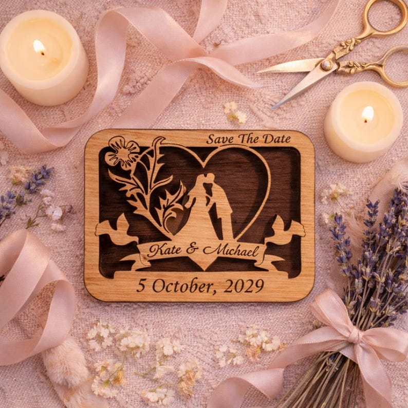 May include: Wooden wedding announcement with a heart-shaped cutout featuring a kissing couple silhouette. The text "Save The Date," "Kate & Michael," and "5 October, 2029" are engraved on the wood. The announcement is surrounded by candles, ribbons, and flowers.