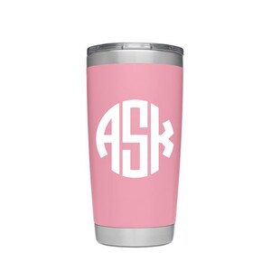 May include: A pink stainless steel tumbler with a white monogram that says "ASK" on the front.