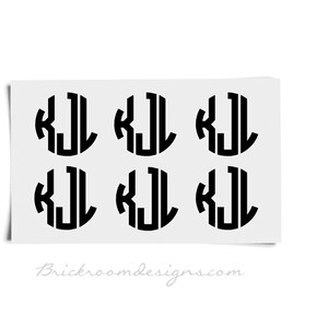 May include: Six black and white monogram stickers with the letters "KJL" in a circle.