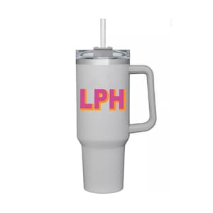 May include: A gray stainless steel travel mug with a black lid and a handle. The mug has a pink and orange "LPH" logo on the front.