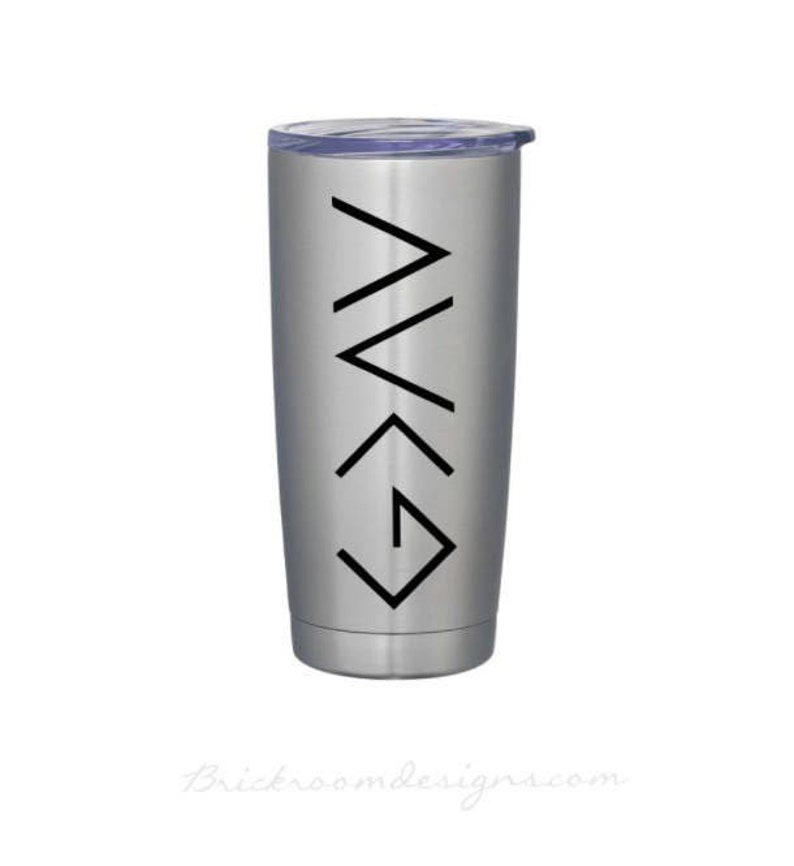 May include: A silver stainless steel tumbler with a black graphic of the Christian symbol "I am with you always" on the side.