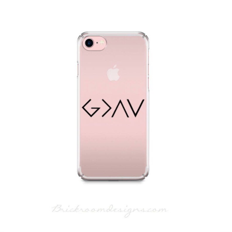 May include: A clear phone case with a pink background and a black graphic of the symbol "G>A<" on the back.