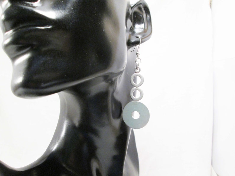 Earrings with steel bolts scrap metals