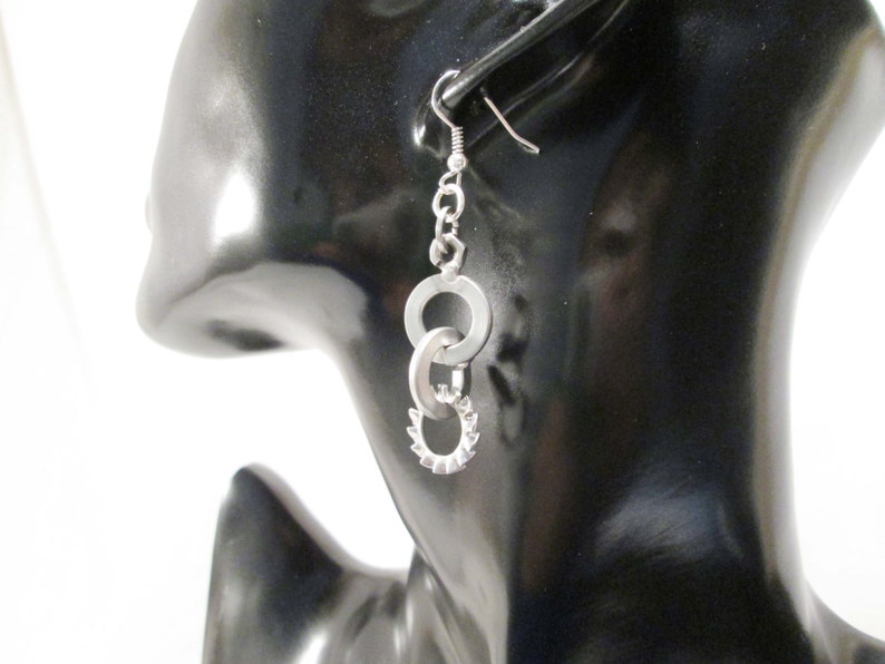 Earrings with steel bolts scrap metals