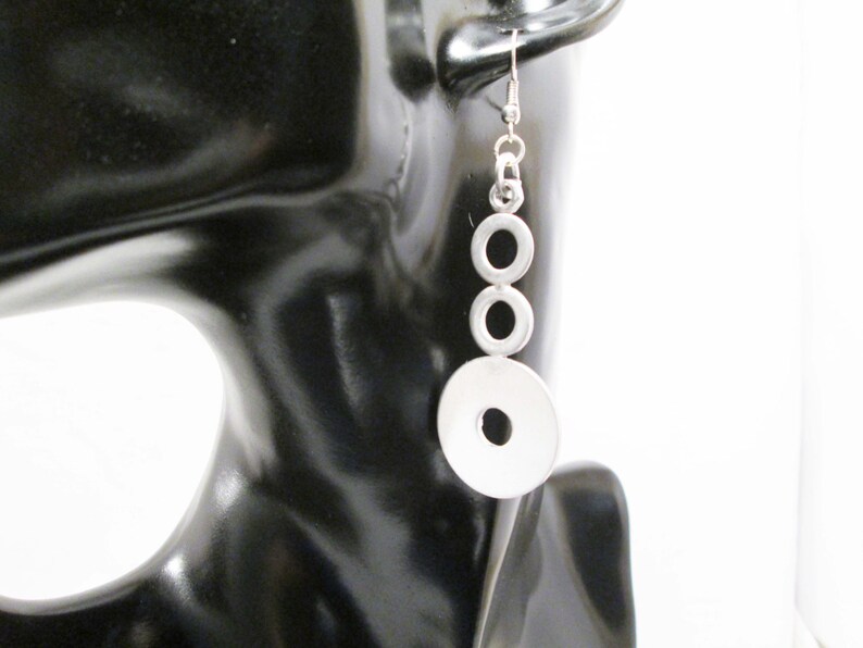 Earrings with steel bolts scrap metals