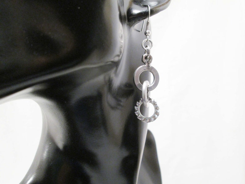 Earrings with steel bolts scrap metals
