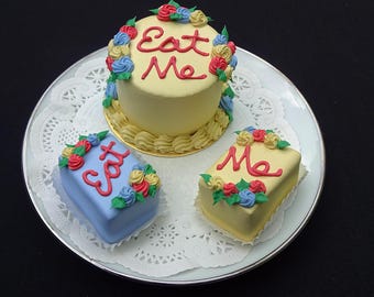 3 Pc. "Eat Me" Faux Cake Set | Alice in Wonderland Display Decor