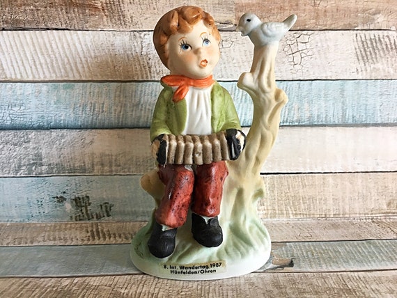 hummel boy with accordion and bird