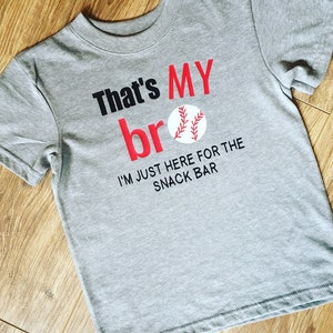 Thats my bro and I'm just here for the snack bar shirt So cute for a little sibling that has to go to the baseball field all the time image 1