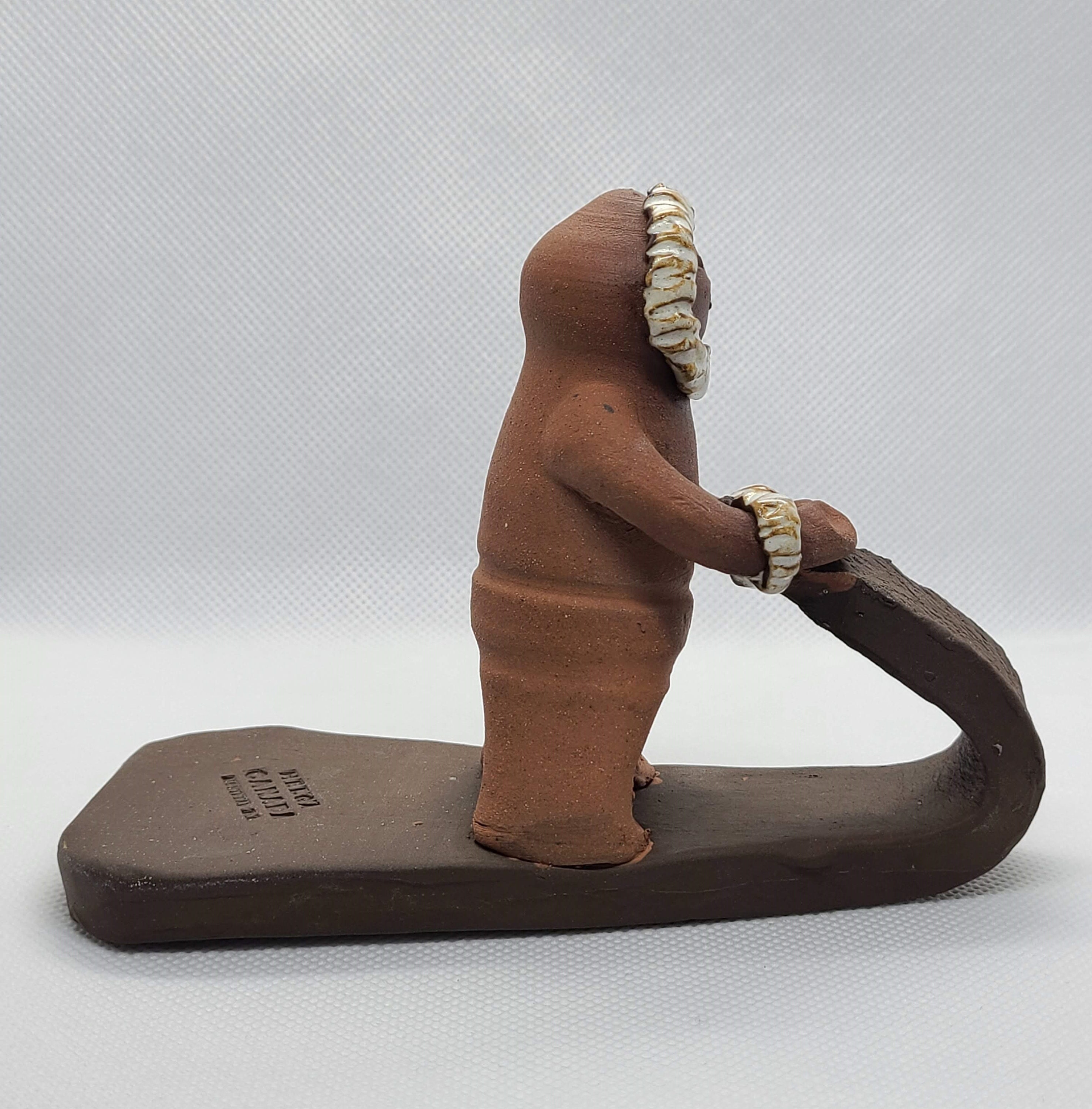 Vintage Canadian Red Clay Pottery Figurine of an Inuit Man on Sled by