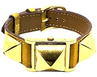 Reloj Medor Vintage Hermes chapado en oro con correa de cuero amarillo