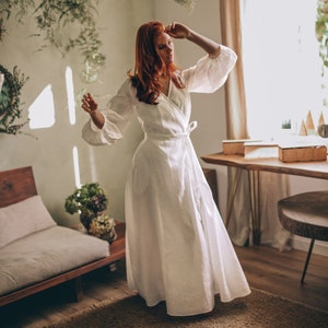 Our staple maxi wrap dress with a rich puff sleeve accent. Made from 100% natural washed and soft linen, this enchanting piece has a V-neckline, side pockets and a tie belt closure that emphasises the waist.