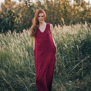 Sleeveless minimalist dress - perfect match for bold jewelry. Long and soft, this maxi dress is made of pure linen that is breathable and pleasant to your body. The elongated cut, deep V-neckline create a beautiful silhouette