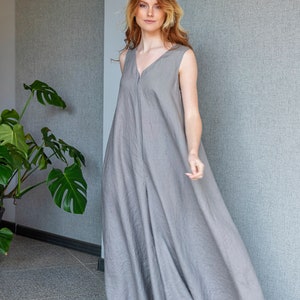 Our linen jumpsuit dress will win many hearts for the balance of elegance and comfort at every step. A wide legged piece that is very suitable for the hot summer days with its breezy, yet elegant and flowy design.