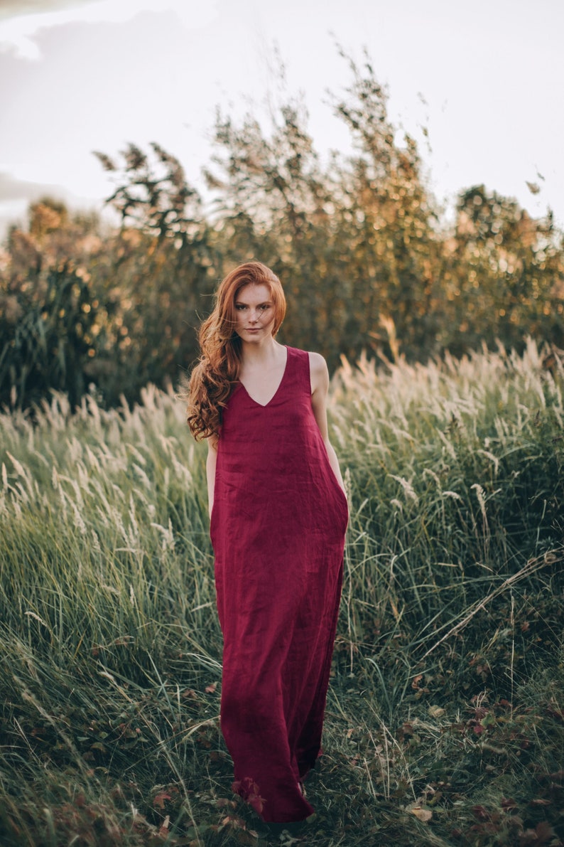 Sleeveless minimalist dress - perfect match for bold jewelry. Long and soft, this maxi dress is made of pure linen that is breathable and pleasant to your body. The elongated cut, deep V-neckline create a beautiful silhouette