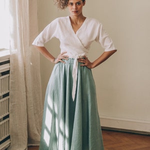 Nothing more feminine than this rich gypsy style skirt that is made of 100% pure linen. This flared midi skirt has a high rise, a waistband and side pockets. Pictured in a dusty turquoise shade here