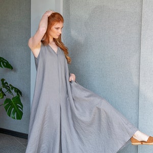 Our linen jumpsuit dress will win many hearts for the balance of elegance and comfort at every step. A wide legged piece that is very suitable for the hot summer days with its breezy, yet elegant and flowy design.