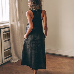 Sleeveless minimalist dress - perfect match for bold jewelry. Long and soft, this maxi dress is made of pure linen that is breathable and pleasant to your body. The elongated cut and halter back create a beautiful silhouette everywhere you go.