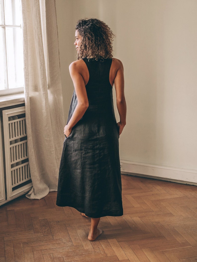 Sleeveless minimalist dress - perfect match for bold jewelry. Long and soft, this maxi dress is made of pure linen that is breathable and pleasant to your body. The elongated cut and halter back create a beautiful silhouette everywhere you go.