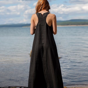 Sleeveless minimalist dress - perfect match for bold jewelry. Long and soft, this maxi dress is made of pure linen that is breathable and pleasant to your body. The elongated cut and halter back create a beautiful silhouette that will turn heads