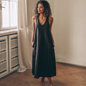 Sleeveless minimalist dress - perfect match for bold jewelry. Long and soft, this maxi dress is made of pure linen that is breathable and pleasant to your body. The elongated cut and halter back create a beautiful silhouette everywhere you go.