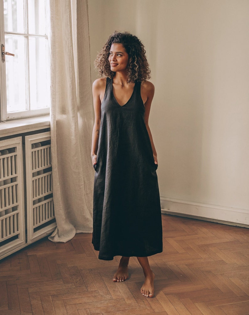 Sleeveless minimalist dress - perfect match for bold jewelry. Long and soft, this maxi dress is made of pure linen that is breathable and pleasant to your body. The elongated cut and halter back create a beautiful silhouette everywhere you go.