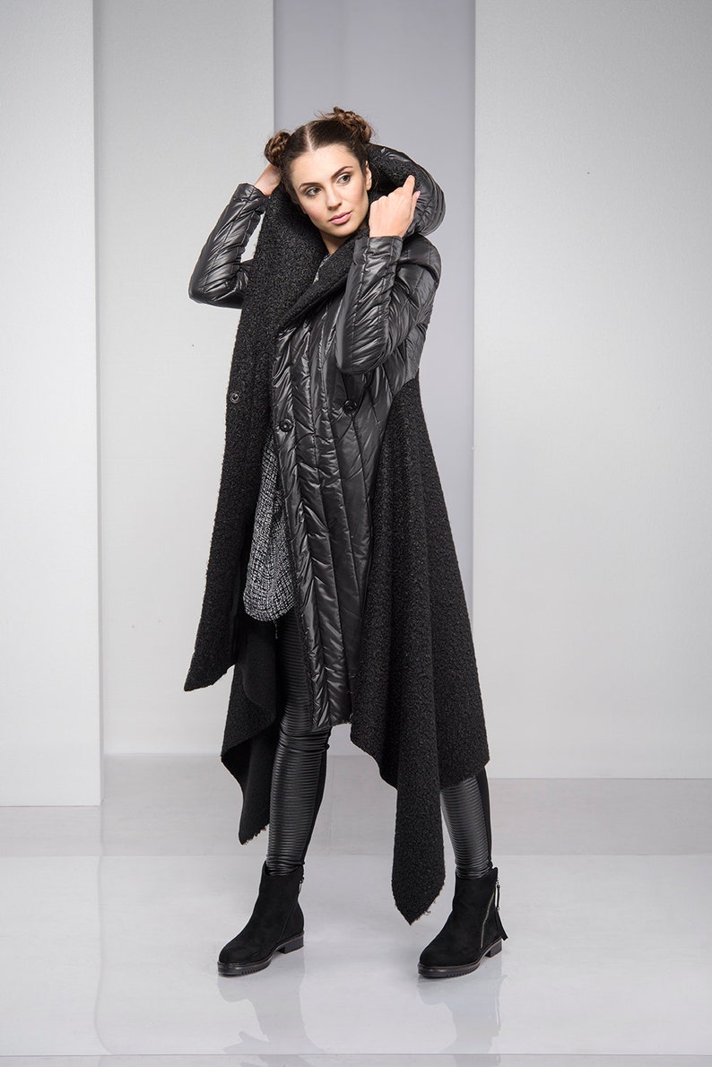 Stylish, fun and warm, this asymmetric jacket with padded detailing will get you compliments all the time! Featuring an oversized hood, button down closure and a silhouette that emphasizes the waist, this coat is both feminine and edgy.