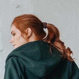 Close-up of wool winter coat with a hood.
