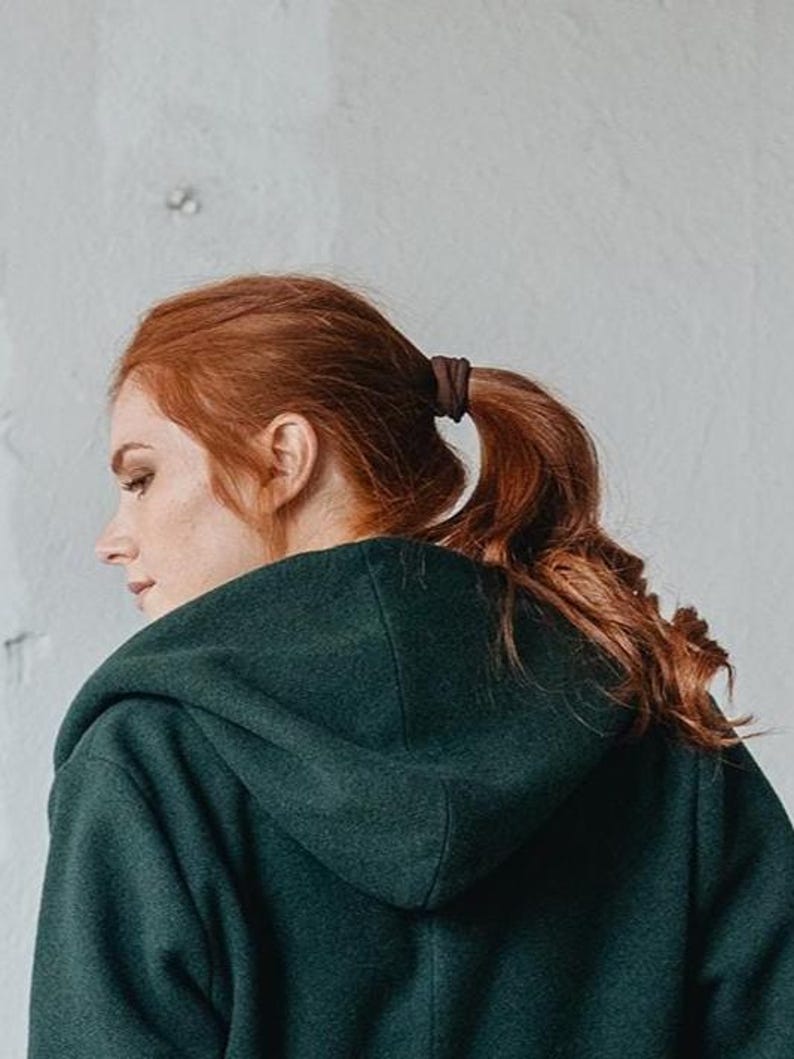 Close-up of wool winter coat with a hood.
