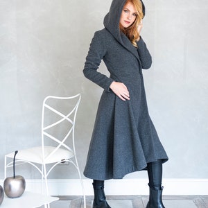 This merino wool coat will be your darling for the chilly days. Featuring an oversize hood and side pockets, this jacket hugs the body at all the right parts and makes you look fabulous.
