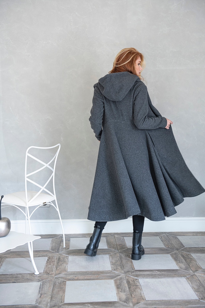 This merino wool coat will be your darling for the chilly days. Featuring an oversize hood and side pockets, this jacket hugs the body at all the right parts and makes you look fabulous.